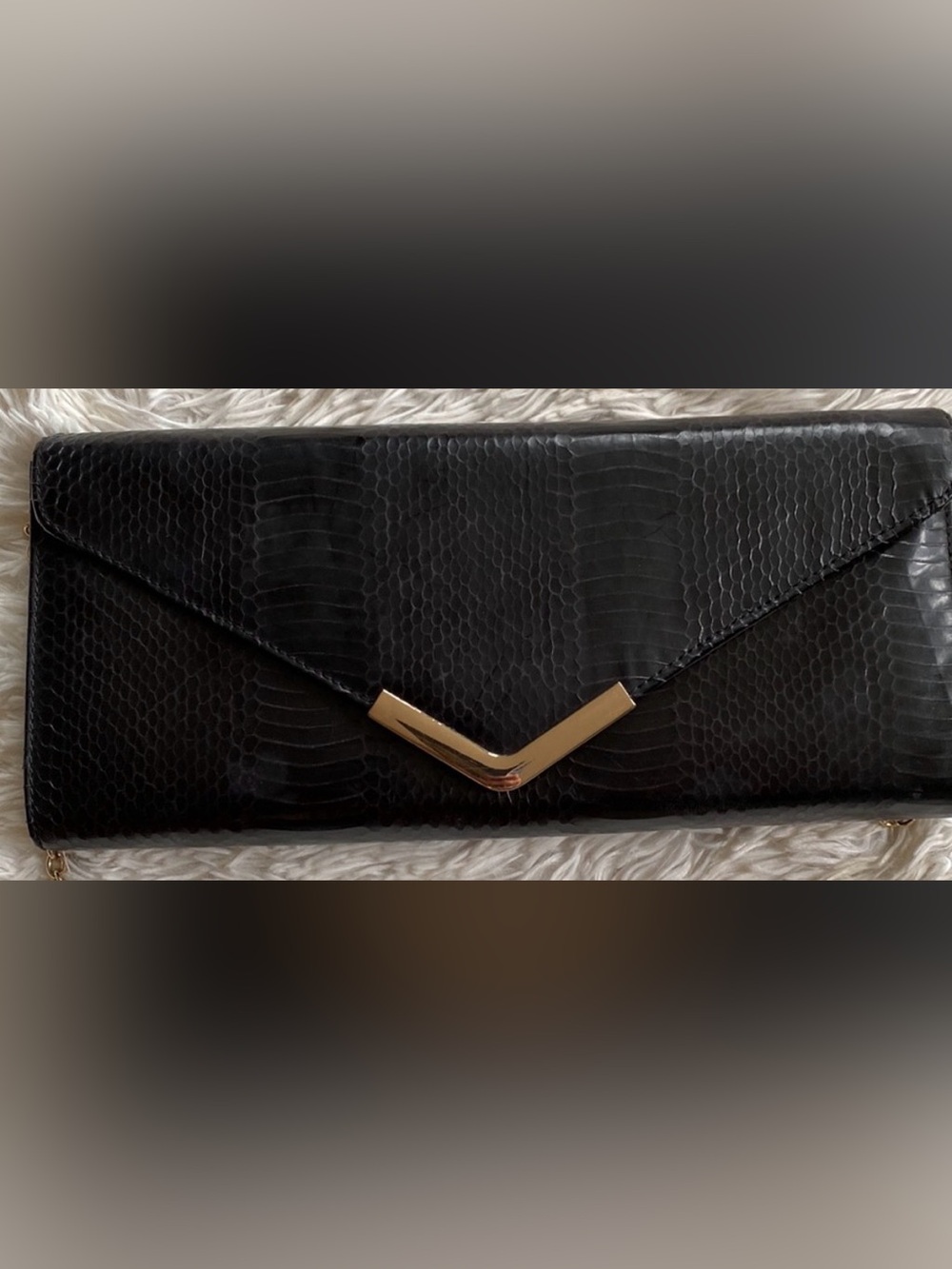 Aldo’s black Leather textured clutch envelope bag